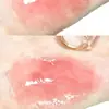 OULESONG té congelado espejo Brillo de labios Luz de agua miel de labios vidrio gelatina tubo redondo productos nacionales brillo de labios transmisión en vivo transfronteriza para mujeres