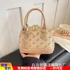 Popular bolsa europea y americana vintage de concha floral, bolso de mano versátil de alta gama, moda transfronteriza 2026, bolso de hombro, bolso cruzado para mujer
