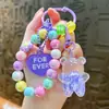 Llavero de oso con cuentas infundidas en aceite transfronterizo, botella de arena líquida, colgante de pulsera colorido, recuerdo, regalo pequeño, venta al por mayor de comercio exterior