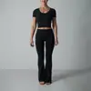 Conjunto de yoga sin costuras cuello en U ajustado transpirable manga corta deportivo Pilates pantalones acampanados para mujer