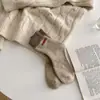Calcetines gruesos con forro de felpa de tubo cálidos para mujer, calcetines populares retro versátiles para pareja, calcetines de rizo con letras para hombre y mujer