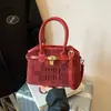 Bolsos de mano de alta gama para mujer, primavera 2026, nuevo estilo, bolsos versátiles, modernos, de nicho, texturizados, con bordado de letras, bolso de hombro