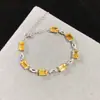 Pulsera de cristal amarillo de la fortuna natural anillo de superficie clásica cuerpo completamente limpio incrustación de precisión piedra principal 5*7mm
