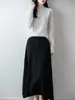 Saia midi de tricô de lã pura para mulheres, outono/inverno 2026, transfronteiriça, cor sólida, padrão torcido, caimento solto, cintura alta, evasê