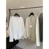 Nova blusa coreana simples versátil para o início do outono, solta, afina a silhueta, decote V, manga longa 66638