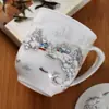 Taza de Té de Cerámica Jingdezhen Hueso de China Porcelana Azul y Blanca con Tapa para Reuniones en Casa Oficina Taza de Té Grabado Venta al Por Mayor