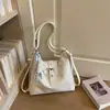 Mochila de nicho para mujer, bolso de hombro único de moda para principios de otoño, moderno y versátil, gran capacidad, estilo coreano, bolsa de mano simple, modelo nuevo