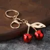 Accesorio de llavero de cereza para bolso, accesorio de bolso de fruta moderno y único, decoración de llave de cereza de alta gama