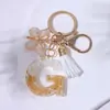 Llavero Colgante de Borla con Letra Inglesa Personalizada de Purpurina Blanca con Resina Epoxi y Colgante de Resina con Pan de Oro, Llavero Sencillo