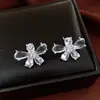 Pendientes de botón de flor de circonita de aguja de plata con diseño único, estilo minimalista de nicho, lujo ligero, sensación de alta gama, pendientes únicos para mujer