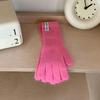 Guantes de punto de color puro nuevos de otoño e invierno, guantes de lana de estilo coreano para estudiantes y niñas, guantes cálidos con pulsera de color caramelo a la moda.