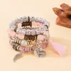 Pulsera de brazalete con colgante de borla de ala redonda estilo bohemio transfronterizo europeo y americano, pulsera de cuentas con cordón elástico multicapa