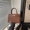 Bolso tejedor casual retro estilo europeo y americano para el trabajo, bolso de mano chic minimalista de lujo ligero 2026, bolso de hombro, bolso cruzado para mujer