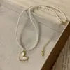 Collar de amor de perla de vidrio de partícula pequeña, diseño de nicho femenino, sentido de diseño, temperamento de lujo ligero, collar de celebridad de internet