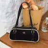 Bolso tipo almohada transfronterizo simple y moderno para mujer, bolso de hombro retro de color contrastante para otoño e invierno, bolso de hombro para commuting, bolso de alta gama
