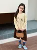 Aimo Beibei 2026 Otoño Nueva Ropa Infantil para Niñas Estilo Coreano Casual Camiseta de Manga Larga con Estampado de Gato Lindo