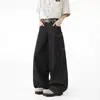 Jeans negros retro de estilo americano para el día a día, con pierna curva, diseño de patchwork estampado de serpiente, bolsillos grandes y estilo workwear de pierna ancha para hombres y mujeres
