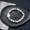 Estilo europeo y americano, pulsera de acero de titanio transfronteriza que no se decolora, ajustable, con un tacto lujoso y de alta gama, adecuada tanto para hombres como para mujeres, un accesorio moderno y versátil