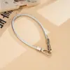 Correa de muñeca única de cuero PU nuevo, cordón para teléfono, cadena de mano colorida versátil de doble hebilla, accesorio de cadena para teléfono