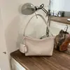 Bolso Femenino para Axila 2026 Nuevo Verano Gama Alta Retro Textura Tejida Bolso de Hombro Único Bolso Bandolera Cubo para Viaje