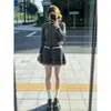 Conjunto de outfit súper popular para mujer para otoño e invierno, nuevo look universitario estilo coreano, conjunto de dos piezas de suéter de punto gris y falda