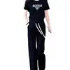 Conjunto de Roupa Esportiva Casual para Mulheres 2026 Verão Nova Moda Estiloso Redutor de Idade Moletom de Gola Redonda Feminino Conjunto de Duas Peças Tendência