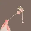 Exquisita horquilla antigua con borla de flor de durazno, simple y moderna horquilla con forma de disco para el cabello, horquilla de alta gama con sentido del estilo cheongsam y hanfu para mujer.