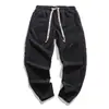 Pantalones casuales de pana con textura de grano de maíz para hombre, estilo chino, ajustados, de moda, disponibles en stock para primavera y otoño, estilo retro japonés y coreano