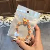 Libro Caperucita Roja Mismo Estilo Estudiante Pulsera de Glaseado de Palomitas de Maíz Hecha a Mano con Cuentas Dibujos Animados Cristal Pulsera Infantil Venta al por Mayor Cajas de Regalo
