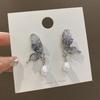 Pendientes de mariposa con perlas y diamantes estilo ins, de alta calidad, únicos, de nicho, de hadas, para mujer, de Corea del Sur, ligeros, de lujo, para las orejas.