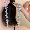 Aretes de poste plateados con diamantes y borlas de perlas, lujo ligero, alta gama, elegantes, modernos, exquisitos, aretes versátiles para mujer al por mayor