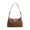 Bolso de Hombro y Axila Simple de Estilo Coreano de Nicho para Mujer 2026 Nuevo Modelo Bolso de Mano para Viajes al Trabajo Bolso Cruzado Versátil de Moda