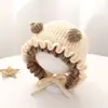 Bonitos y adorables gorros de otoño e invierno para niños, con diseño de poner, material de punto y una serie de dibujos animados, que brindan abrigo y protección para los oídos para bebés y niños pequeños.
