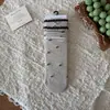 Calcetines de altura media con estampado floral y lazo de burbuja estilo coreano Peiqiao, dulces y femeninos, calcetines sin costuras de algodón puro, venta al por mayor de la industria del calcetín de Zhuji