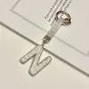 Pingente de chaveiro de carro com 26 letras em inglês cravejado de diamantes transfronteiriço, decoração de bolsa com strass de argila, atacado de chaveiro de celular