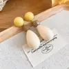 Pendientes de Botón Ovalados de Resina Transfronterizos Europeos y Americanos Pendientes Maillard de Otoño e Invierno Pendientes Simples de Moda Versátiles para Mujer Sensación de Alta Gama