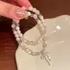 Pulsera Apilada de Doble Capa con Lazo de Perlas para Mujer, Pulsera de Lujo Ligero de Nicho de Gama Alta, Joyería de Mano Exquisita Adecuada para el Verano
