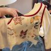 Conjunto de Camiseta de Dibujos Animados Graffiti Falsa Dos Piezas y Jeans Rectos de Cuadros para Niña Pequeña, Otoño Nuevo, Moderno