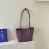 Bolsa transfronteiriça de nova textura feminina versão coreana versátil trançada PU bolsa de ombro única feminina estilosa retrô para o dia a dia bolsa mãe-filho