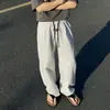 Calça xadrez de gaze bolha preta de secagem rápida para homens, estilo fino de verão, calça de perna larga versátil e moderna, calça casual reta solta