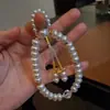 Pulsera Francesa Retro de Lujo Ligero con Borla de Perlas, Moda de Nicho, Exquisita y Sencilla, Diseño de Alto Valor, Accesorio de Mano Versátil para Mujer