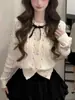 Elegante cárdigan de punto con lazo de pedrería estilo coreano, suave y versátil, moderno top nuevo de ajuste ceñido para mujer de otoño e invierno