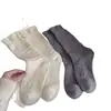 Calcetines de encaje de rombos con estampado oscuro para otoño e invierno, calcetines holgados de lana suave de color liso, engrosados y cálidos, calcetines para mujer de Zhuji