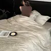 Conjunto de cama luxuoso e sofisticado de quatro peças, em algodão de fibra longa de 50 fios, dupla torção, com bordado jacquard, para dormir nu, adequado para todas as estações.
