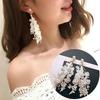 B253 aretes de perlas con cinta de personalidad y temperamento de moda aretes largos de encaje con flor hueca outlet de fábrica