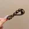 Pinza para el pelo de dibujos animados peculiar con giro para niñas, pinza de garra para el pelo de alta gama para la parte posterior de la cabeza, accesorio para el cabello