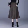 Elegante falda de piel sintética con bolsillos para mujer, nueva colección otoño 2026, de cintura alta, falda de línea A estilizada, elegante y versátil para el trabajo, falda acampanada de moda