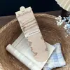Combinación de estampado floral retro Songmu, detalle de encaje y lazo estilo coreano, calcetines de algodón hasta la mitad de la pantorrilla, calcetines de lunares dulces y versátiles para mujer