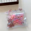 Bolsa de estrella fresca y simple banda de goma desechable para el pelo banda elástica alta anillo de goma duradero no daña el pelo liga para el pelo de niños al por mayor