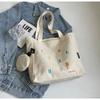 Bolsa de lona feminina 2024 primavera e verão nova garota casual coração bolsa de ombro grande capacidade para todos os jogos bolsa de pano de transporte